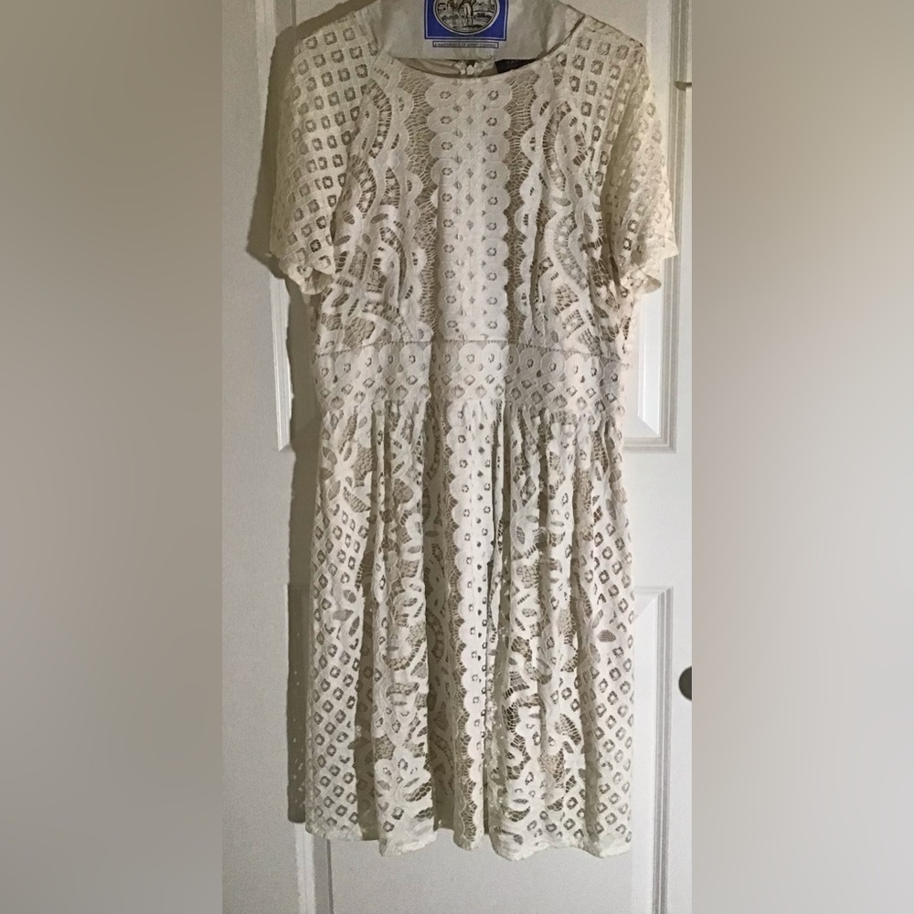 Cream one piece cut out pattern dress, size 12, short sleeve